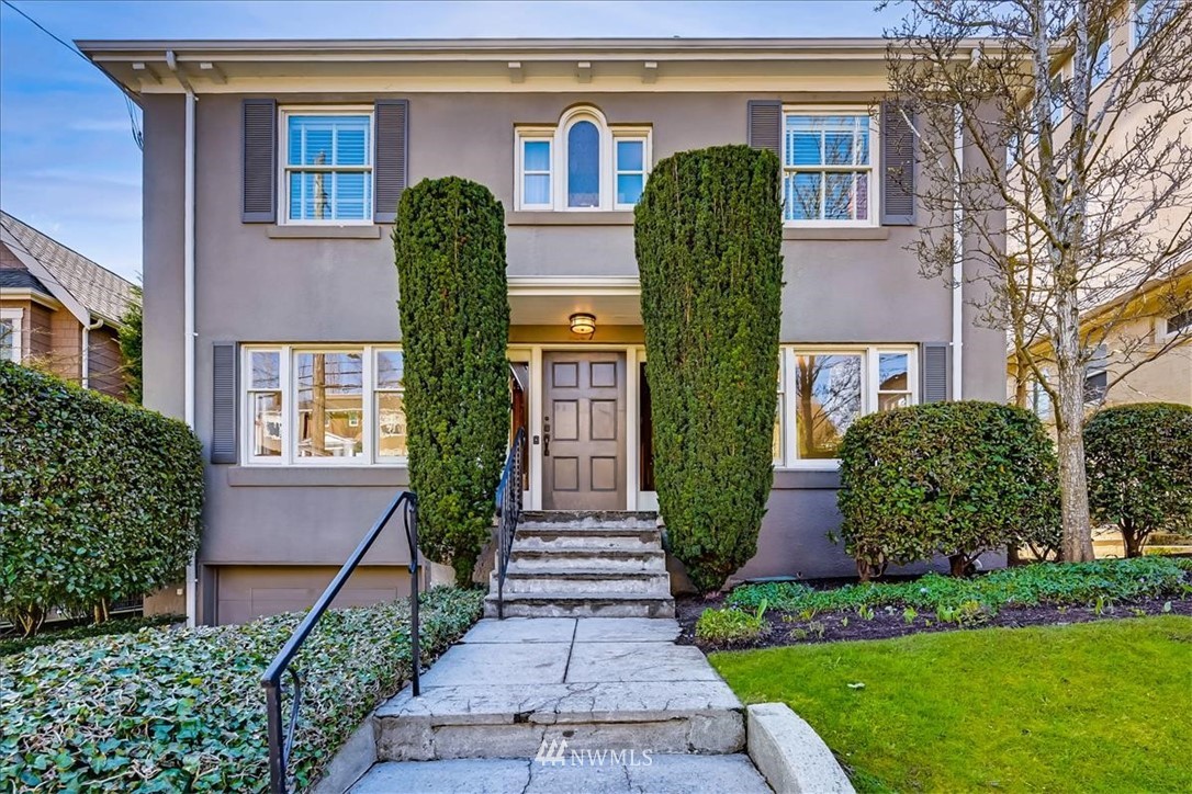 357 Highland Drive Seattle, WA 98109 - Photo 19 of 38 a front view of a house with garden