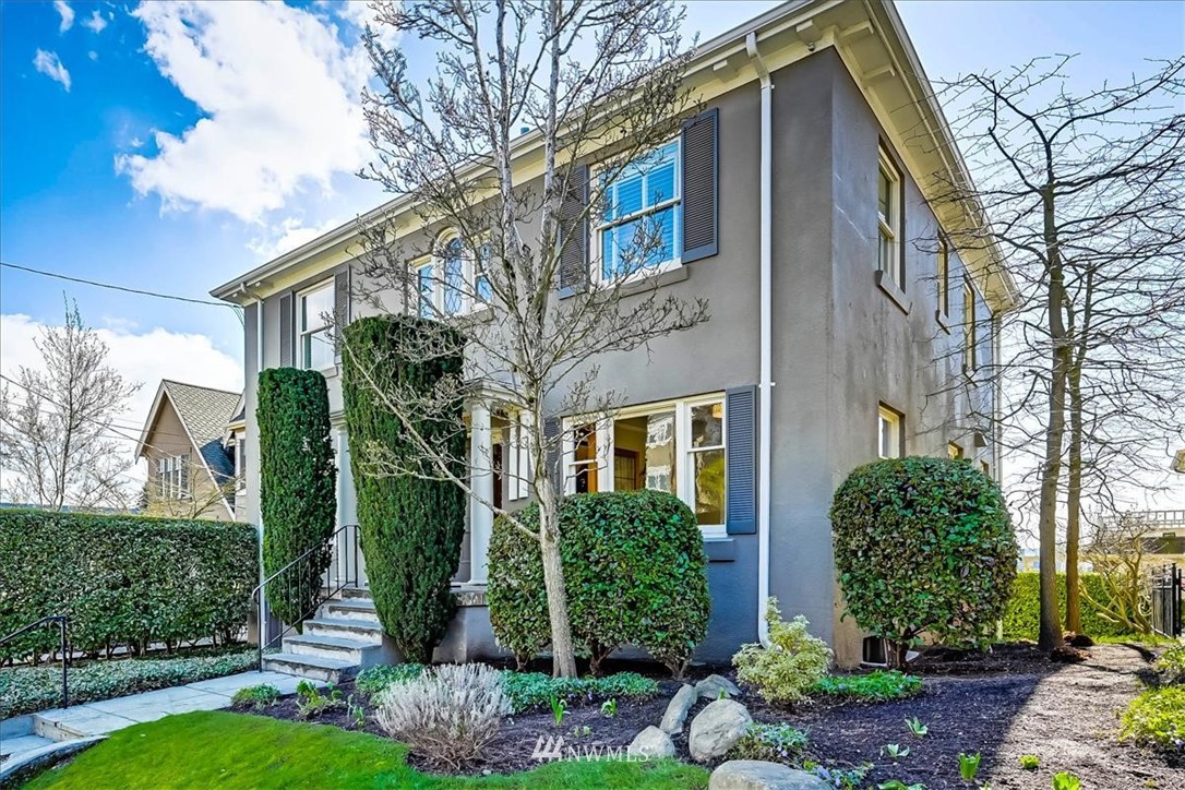 357 Highland Drive Seattle, WA 98109 - Photo 2 of 38 a front view of a house with garden