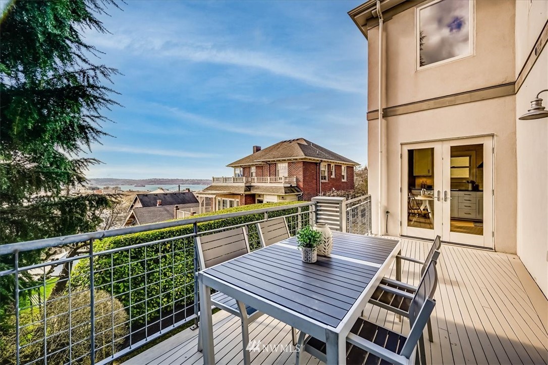 357 Highland Drive Seattle, WA 98109 - Photo 31 of 38 a view of a deck with wooden floor and seating space