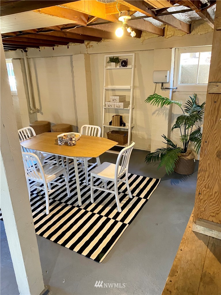 357 Highland Drive Seattle, WA 98109 - Photo 32 of 38 a front view of a house with a garden