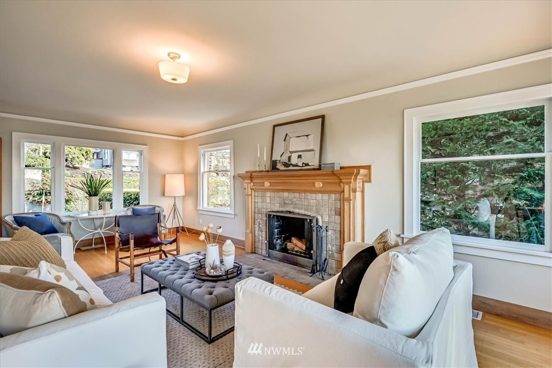 357 Highland Drive Seattle, WA 98109 - Photo 6 of 38 a living room with furniture and a fireplace
