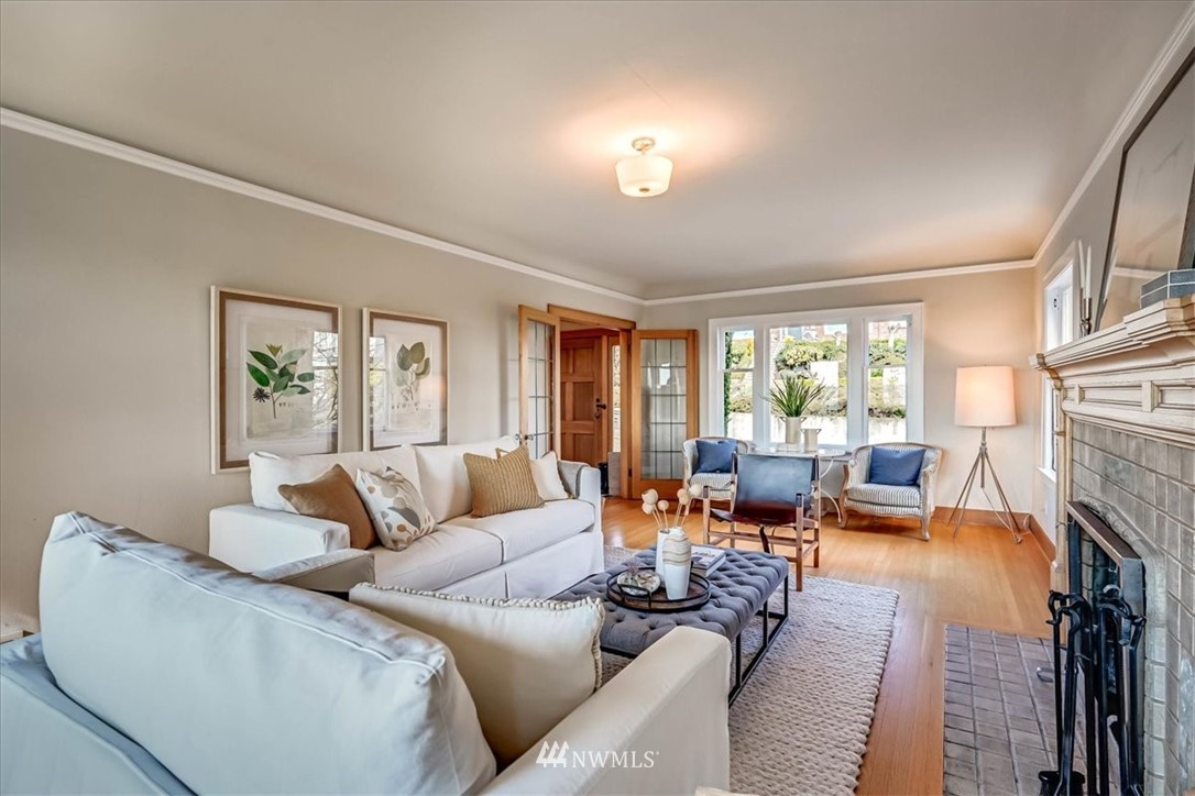 357 Highland Drive Seattle, WA 98109 - Photo 7 of 38 a living room with furniture and a fireplace