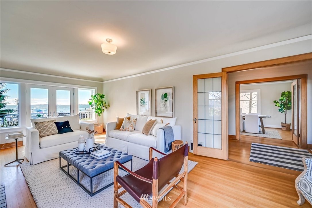 357 Highland Drive Seattle, WA 98109 - Photo 8 of 38 a living room with furniture and a large window