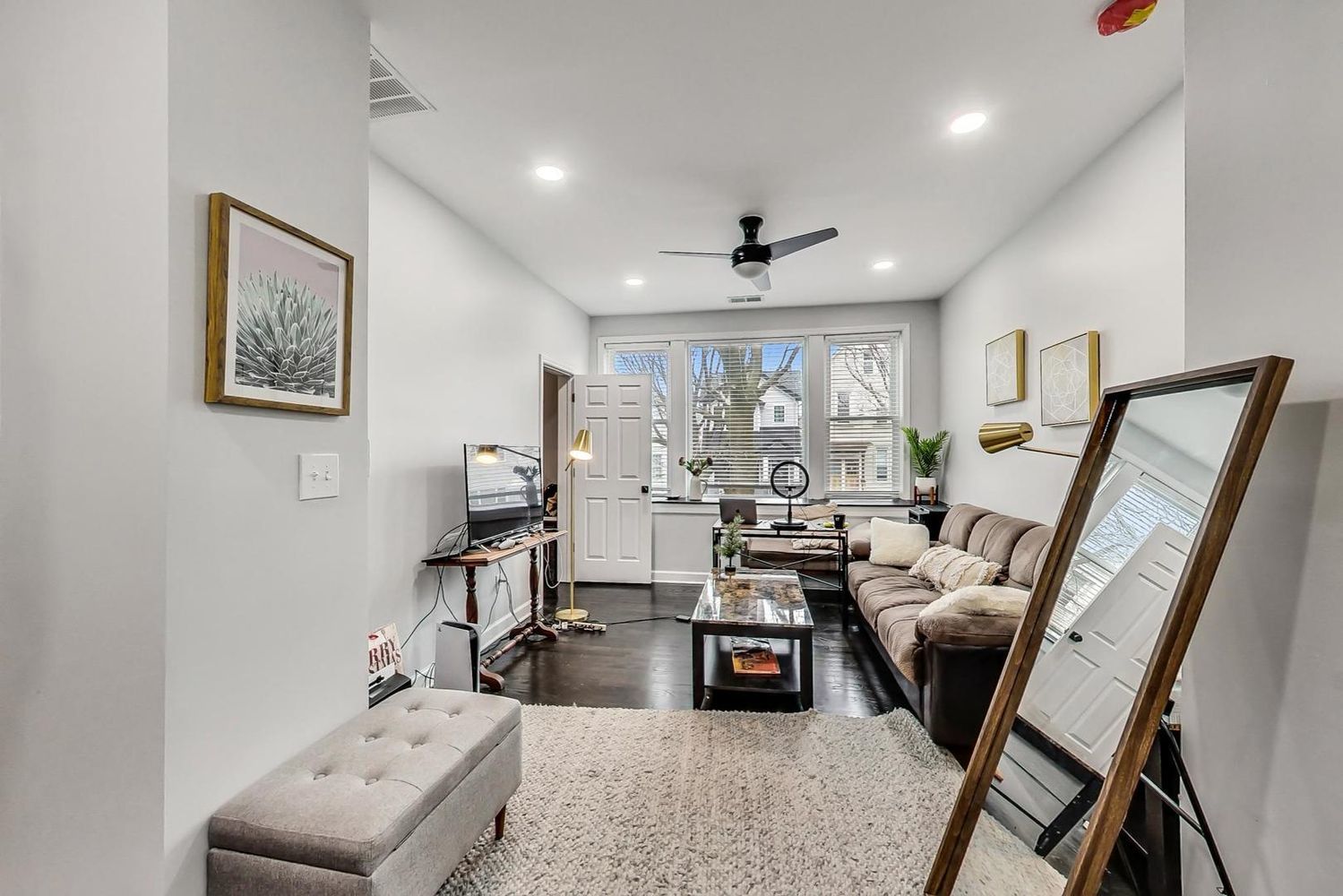 2025 West Melrose Street, Unit 2F Chicago, IL 60618 - Photo 5 of 18 a living room with furniture and a large window