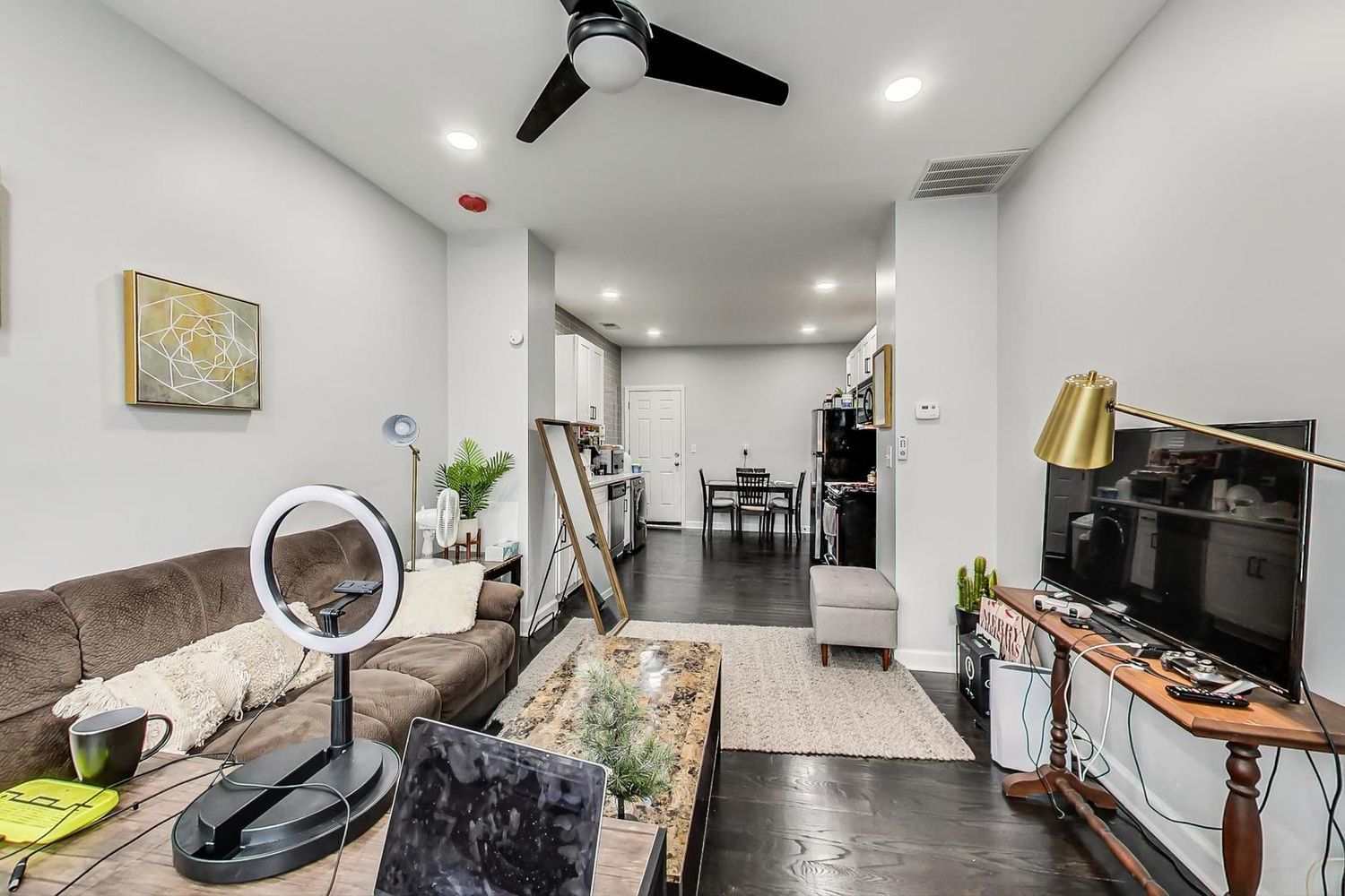 2025 West Melrose Street, Unit 2F Chicago, IL 60618 - Photo 6 of 18 a living room with furniture and a flat screen tv