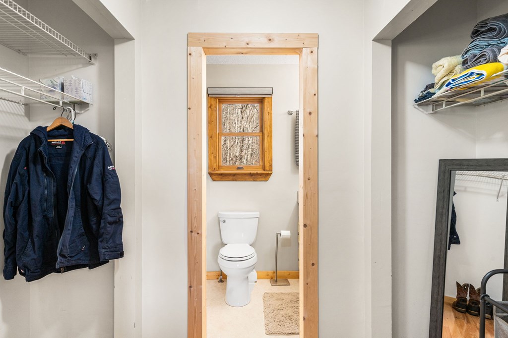 224 Shake Rag Road Hiawassee, GA 30546 - Photo 26 of 47 a view of walk in closet with clothes and shoes