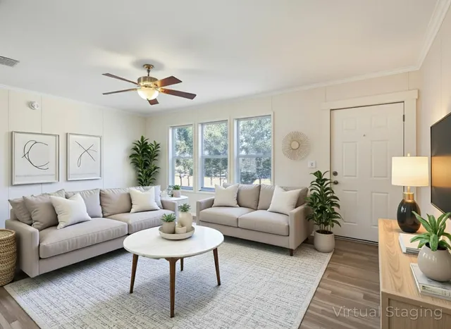 a living room with furniture and a large window