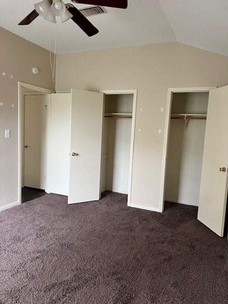 4409 Rattan Avenue Bay City, TX 77414 - Photo 13 of 13 an empty room with closet and a chandelier fan