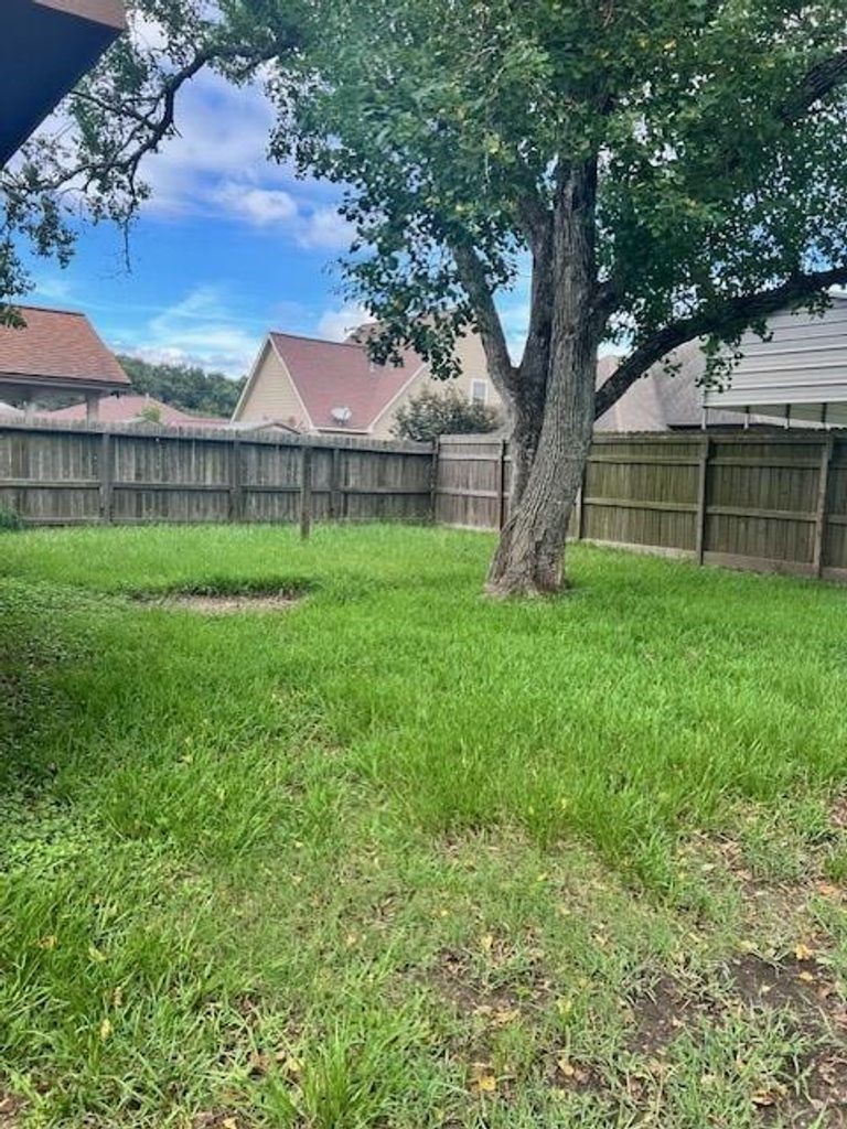 4409 Rattan Avenue Bay City, TX 77414 - Photo 2 of 13 a view of a backyard of the house