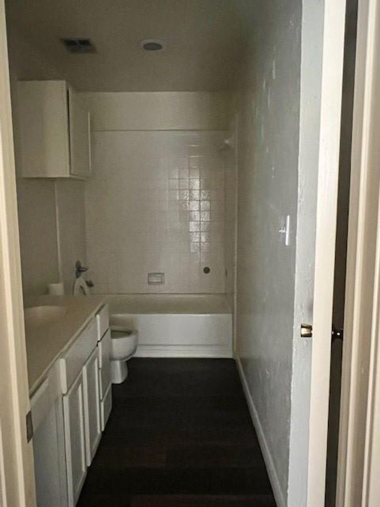 4409 Rattan Avenue Bay City, TX 77414 - Photo 8 of 13 a bathroom with a bathtub and sink