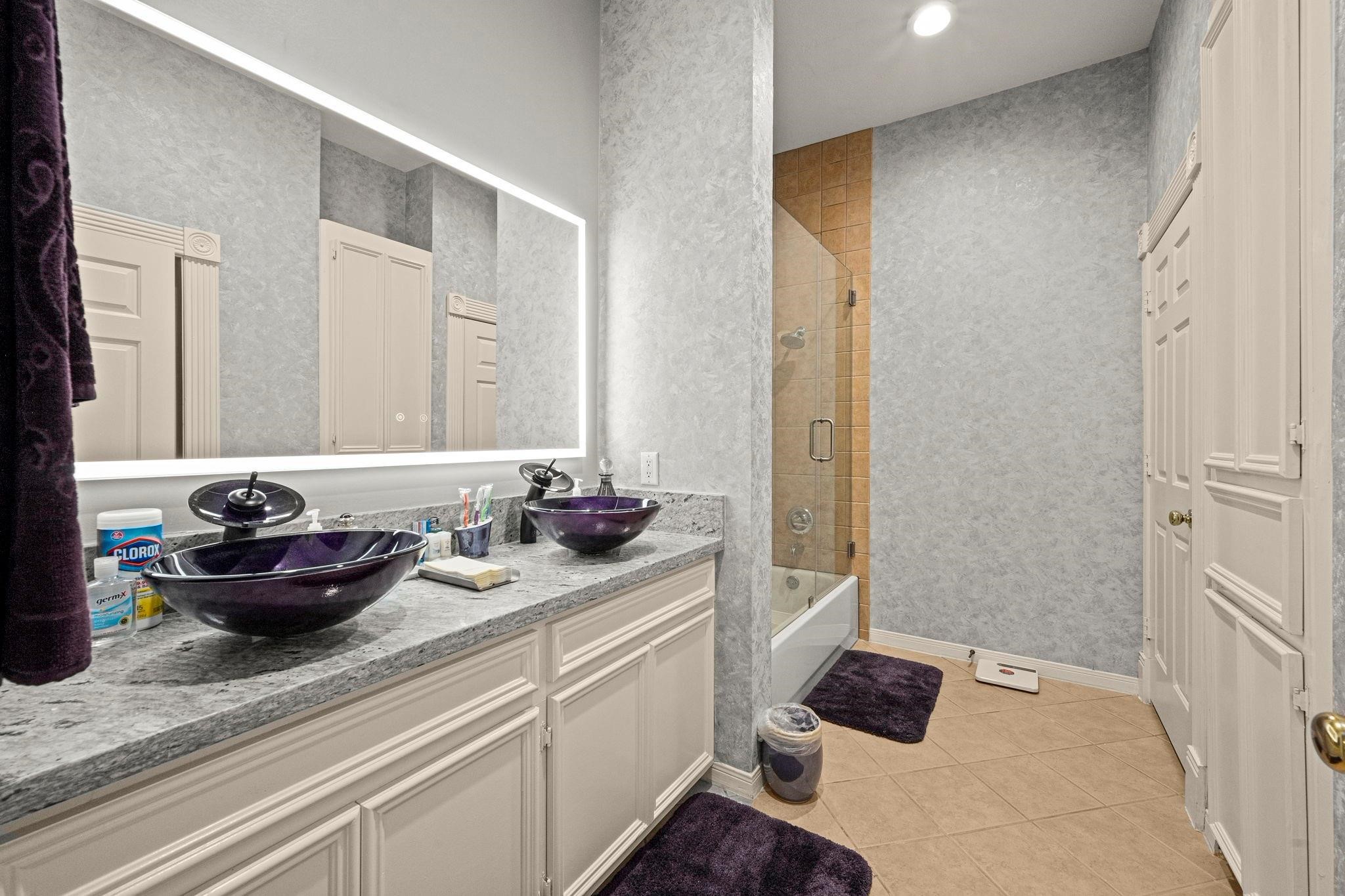 19525 Doerre Road Spring, TX 77379 - Photo 27 of 39 a bathroom with a sink and a mirror