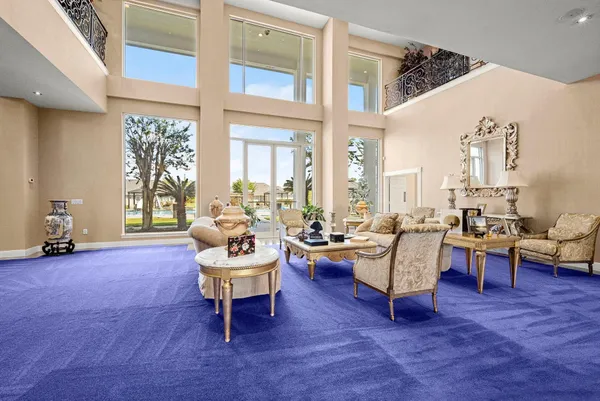 a large kitchen with a table and chairs