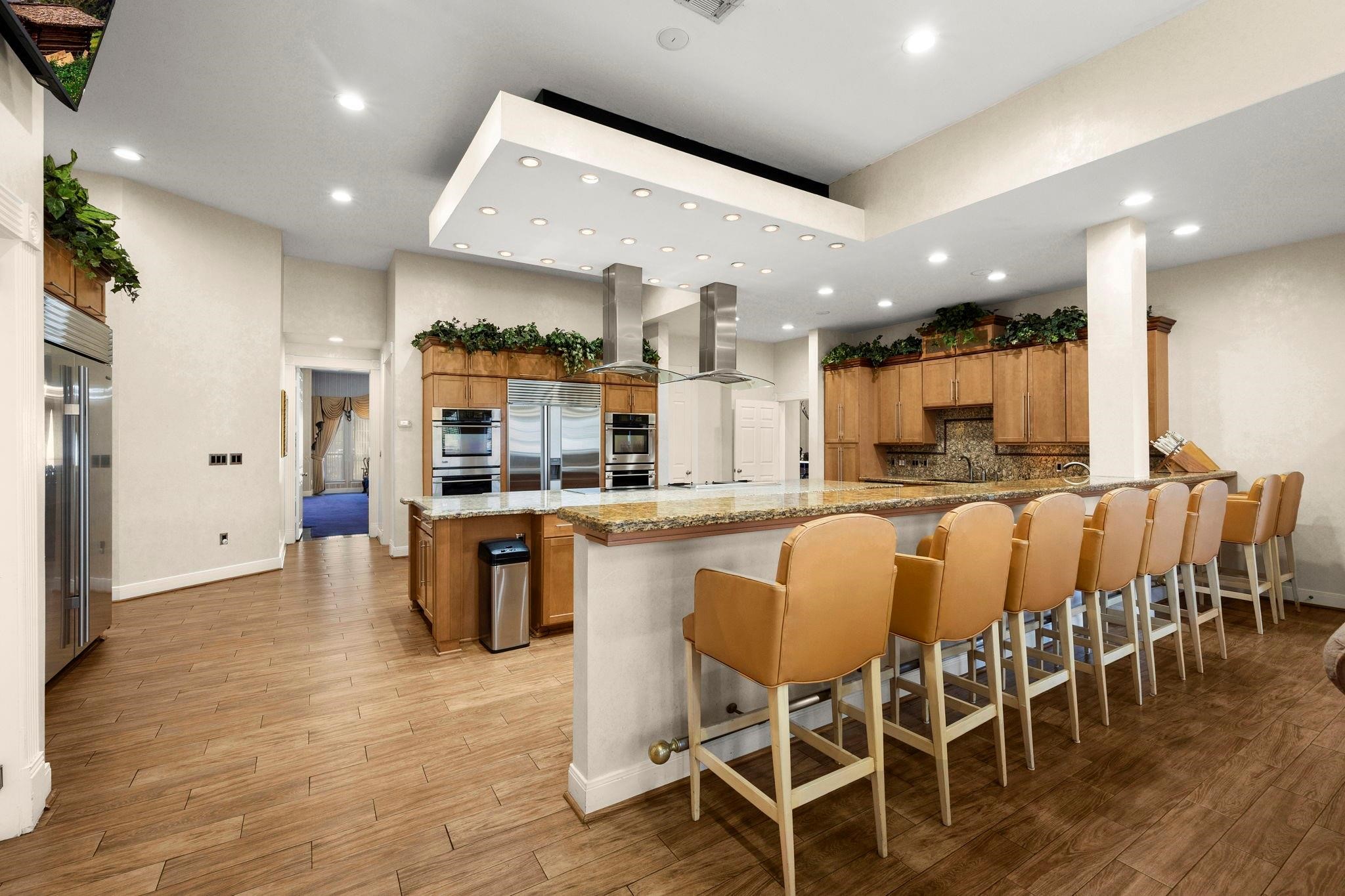 19525 Doerre Road Spring, TX 77379 - Photo 9 of 39 a large kitchen with a table and chairs