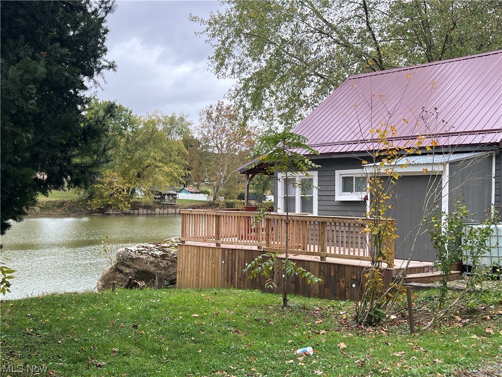 530 South Riverview Road Malta, OH 43758 - Photo 2 of 34 View of yard featuring a deck with water view