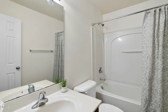 a aerial view of a house with garden and plants