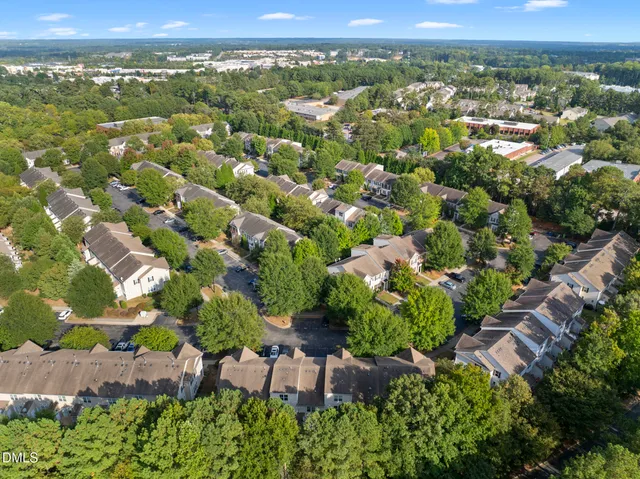 front view of a brick house with a yard