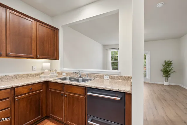 a kitchen with a sink and cabinets