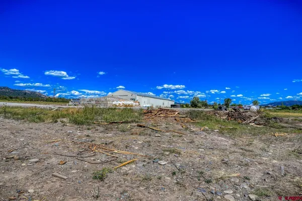 a view of a town with mountains in the background