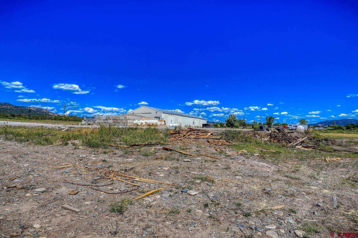 13806 State Highway Ignacio, CO 81137 - Photo 13 of 45 a view of a lake with a building in the background