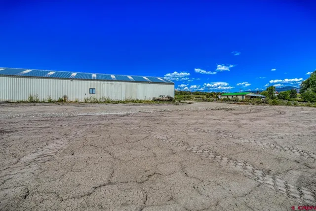 a view of a road with a building in the background