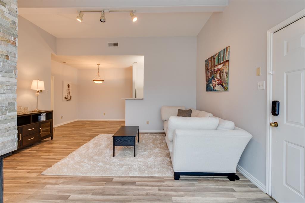 2100 Randy Snow Road, Unit 412 Arlington, TX 76011 - Photo 7 of 32 a living room with furniture and a wooden floor