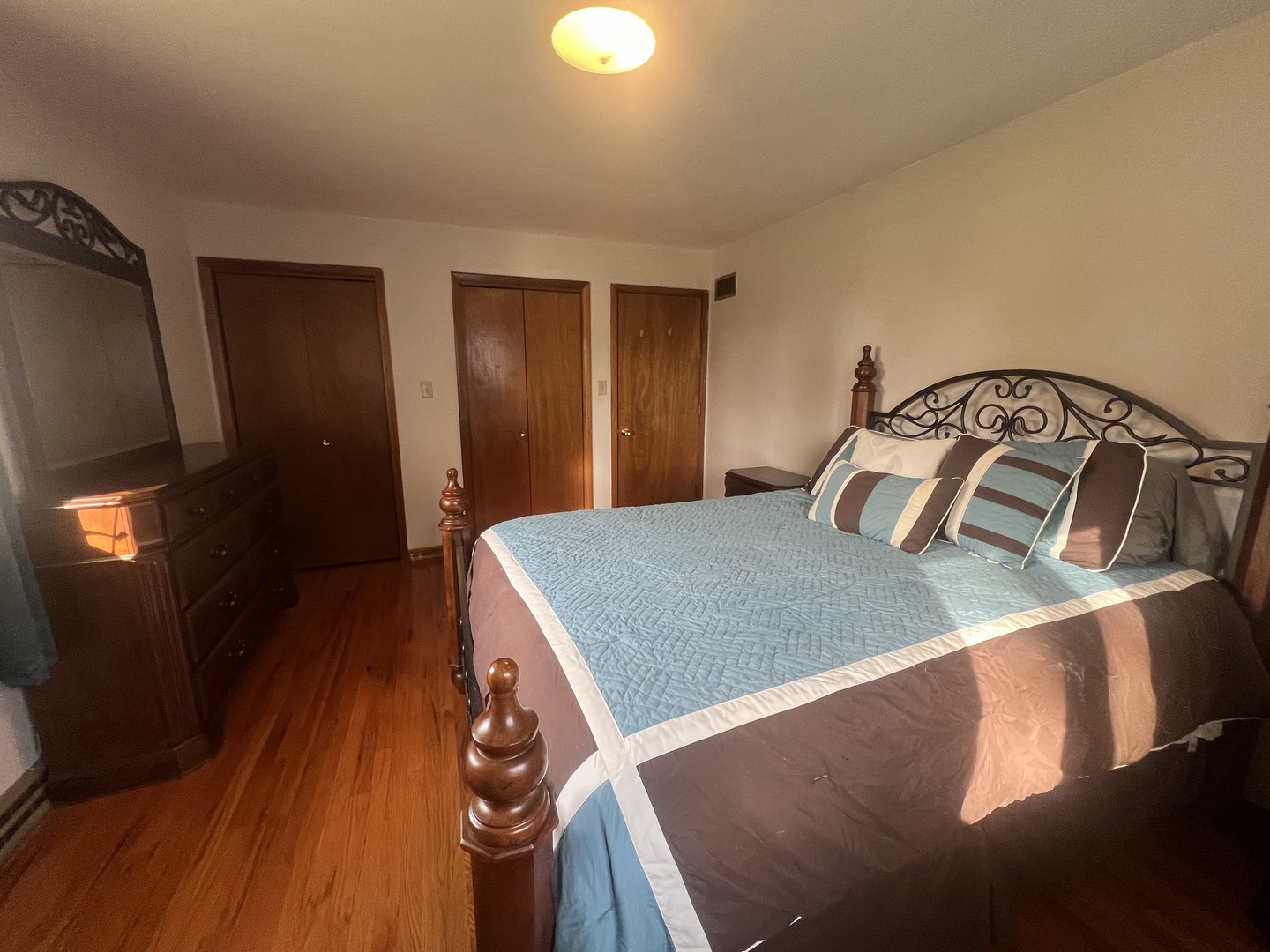 1380 South Regan Road New Lenox, IL 60451 - Photo 12 of 39 a bedroom with a bed and a mirror