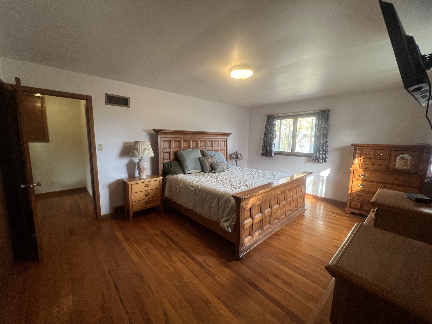 1380 South Regan Road New Lenox, IL 60451 - Photo 13 of 39 a bedroom with a bed and wooden floor