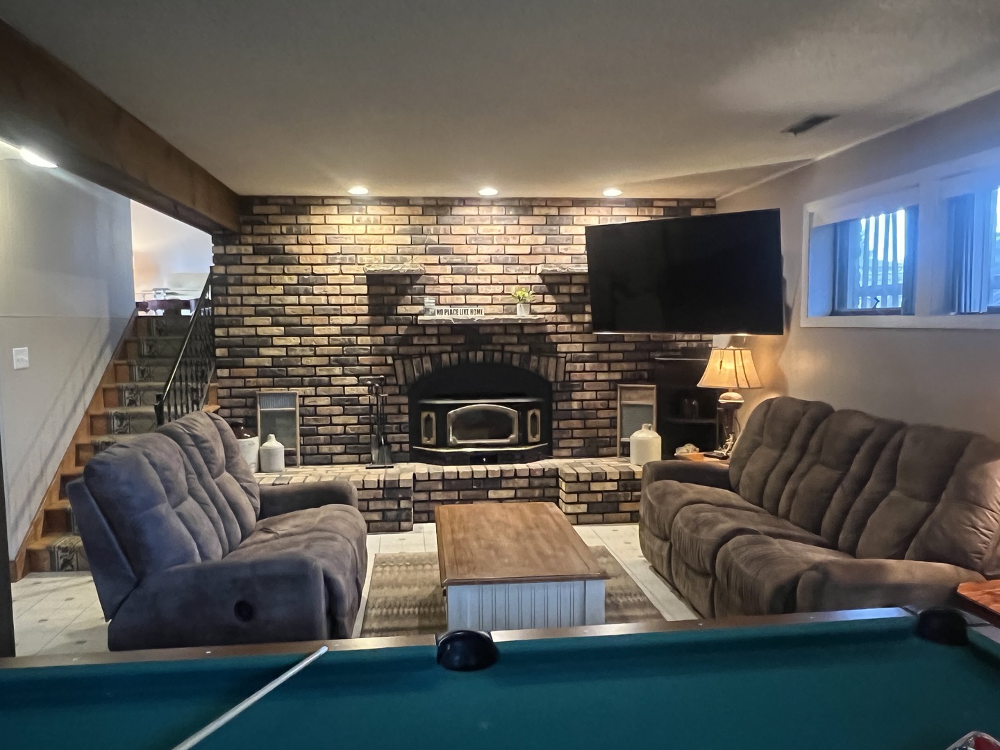 1380 South Regan Road New Lenox, IL 60451 - Photo 25 of 39 a living room with furniture a flat screen tv and a fireplace