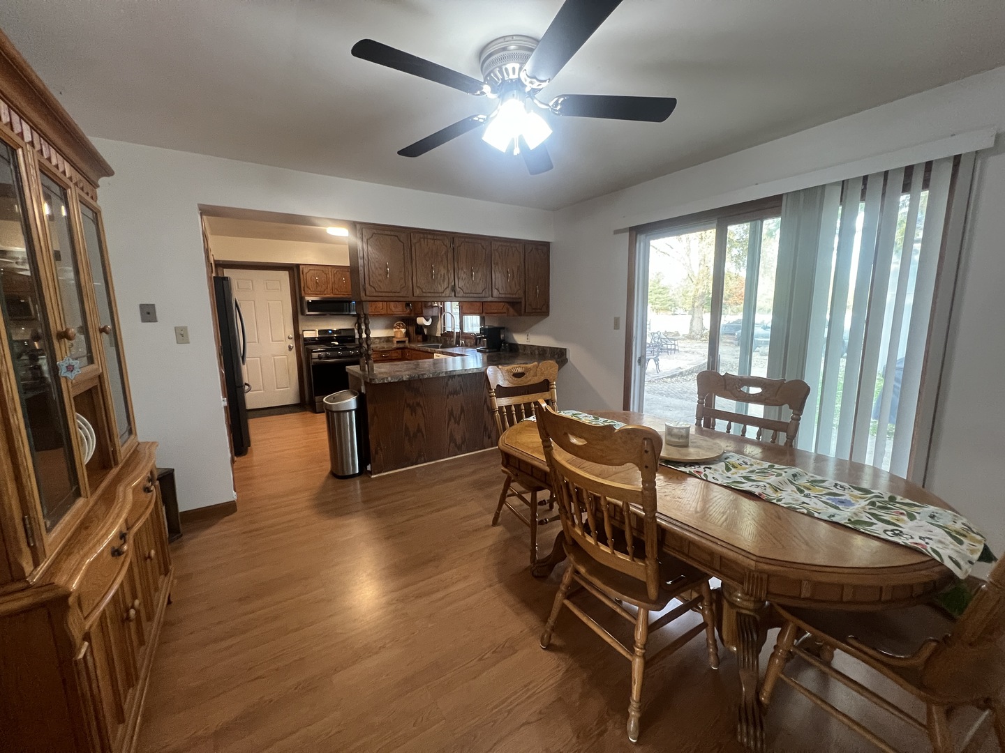 1380 South Regan Road New Lenox, IL 60451 - Photo 5 of 39 a view of a dining room with furniture window and wooden floor