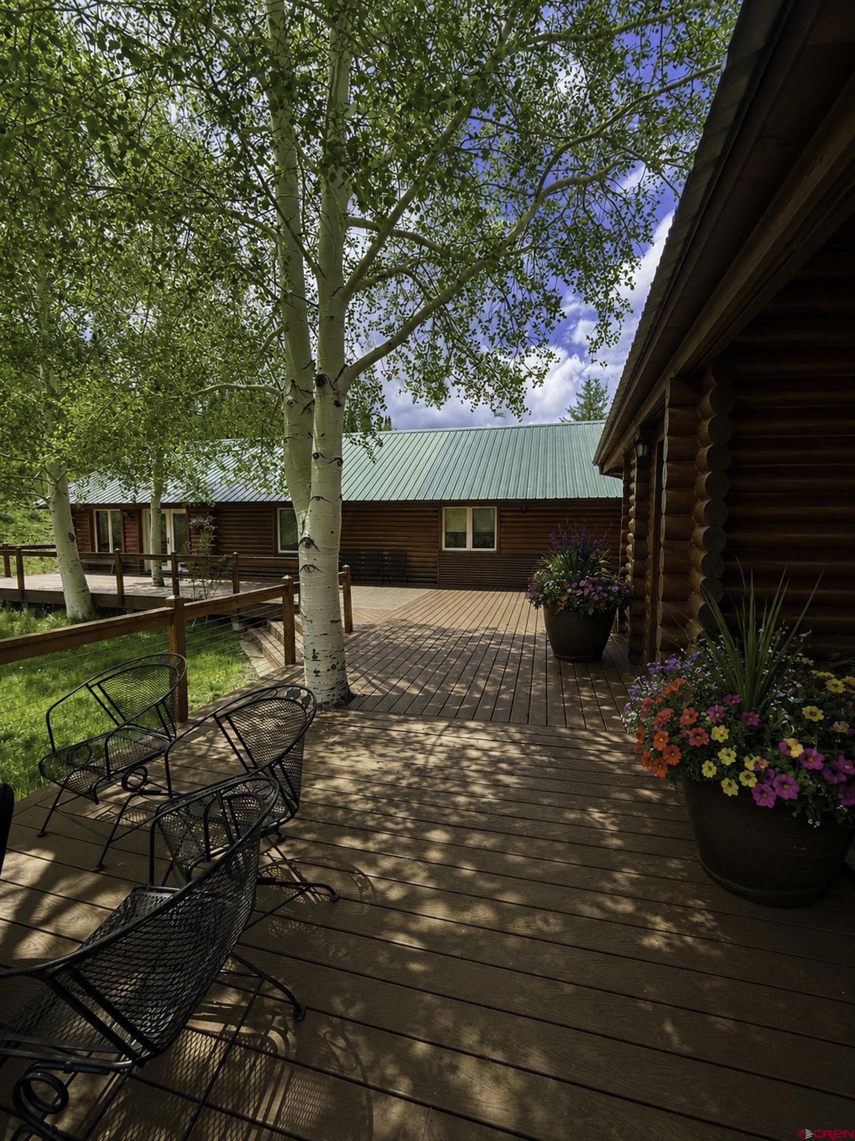 684 Falcon Way Montrose, CO 81403 - Photo 37 of 43 a view of a backyard with potted plants