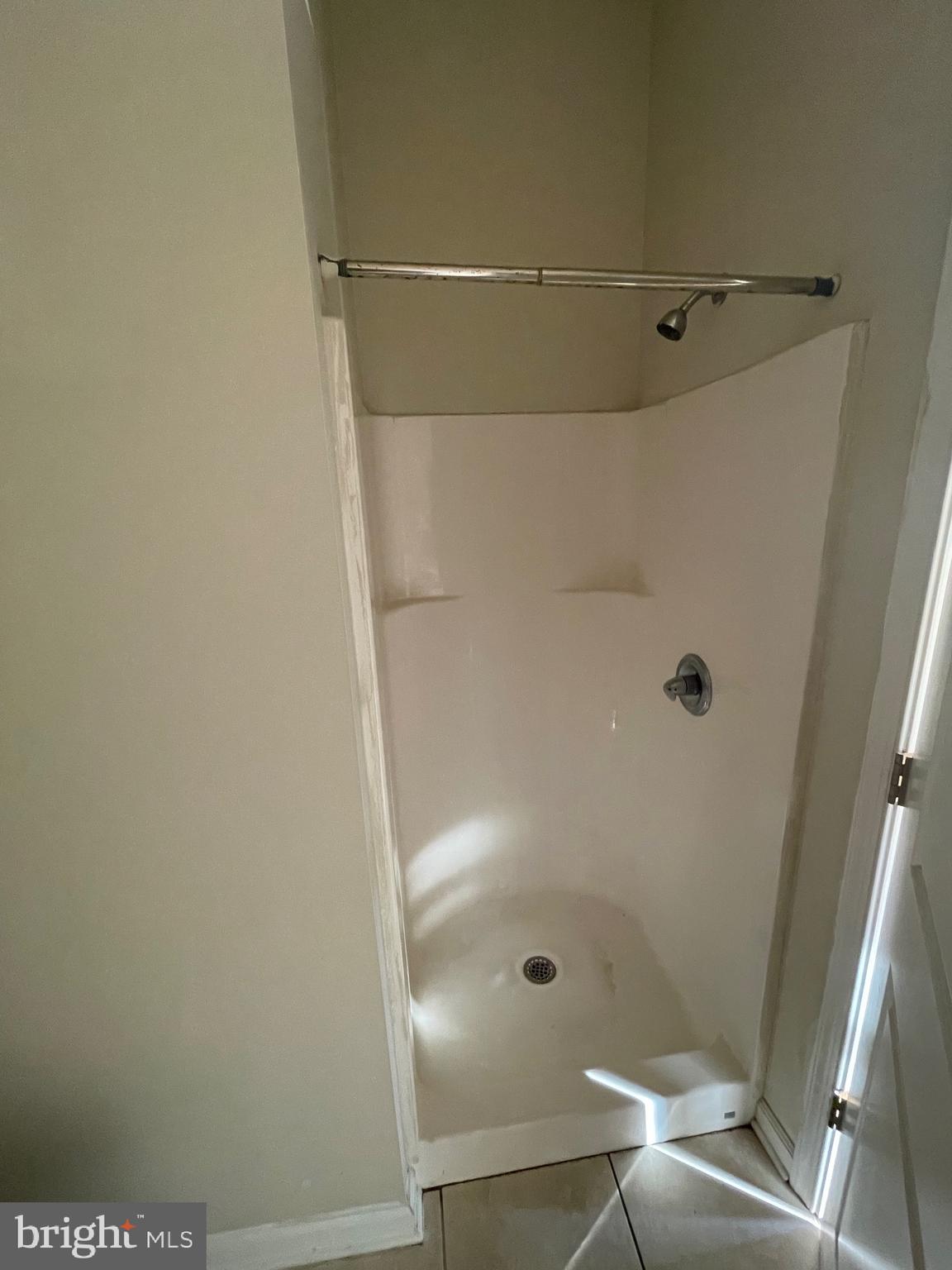 408 Wiota Street Philadelphia, PA 19104 - Photo 14 of 25 a bathroom with a glass shower door