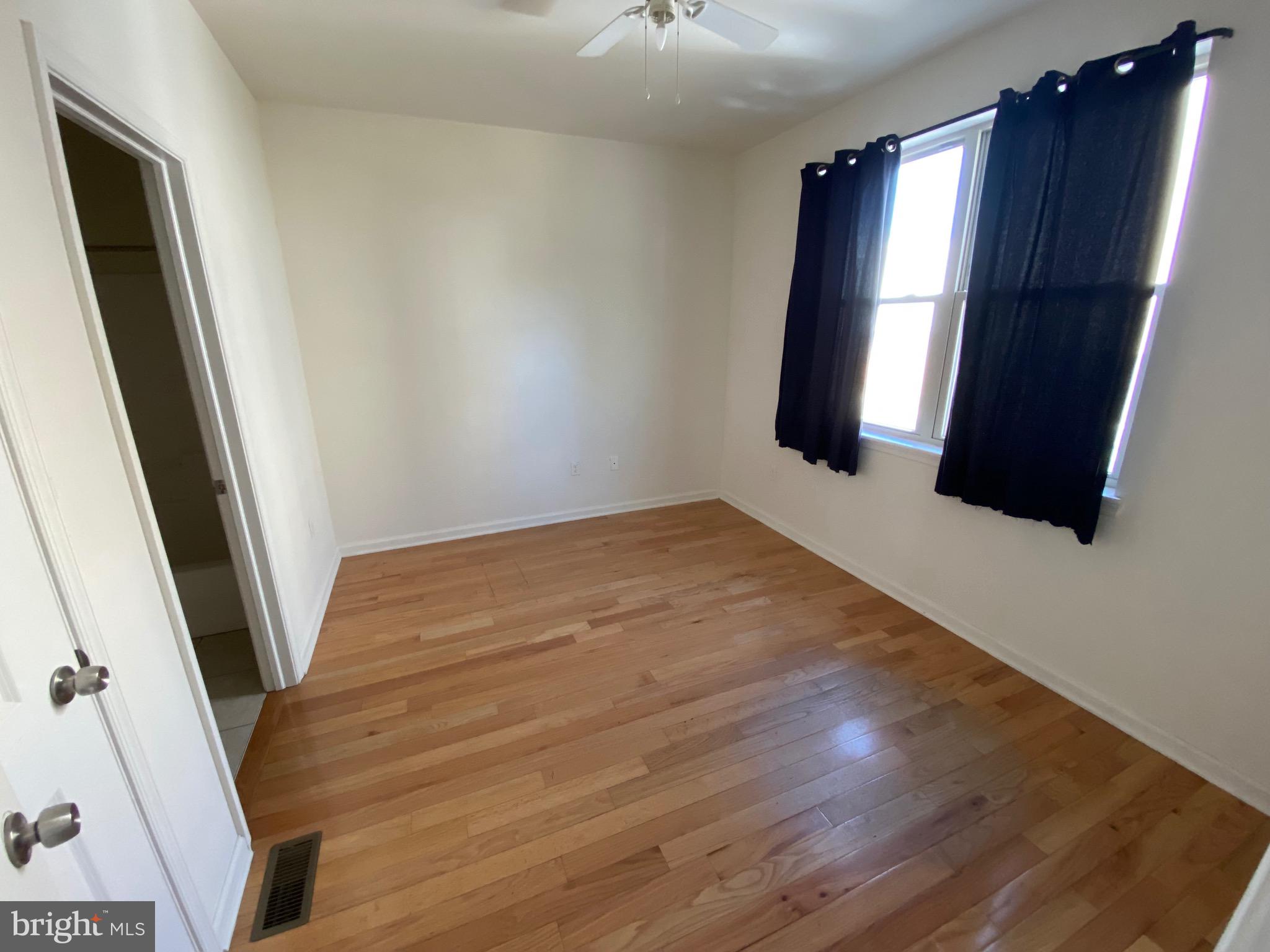 408 Wiota Street Philadelphia, PA 19104 - Photo 22 of 25 wooden floor in an empty room with a window