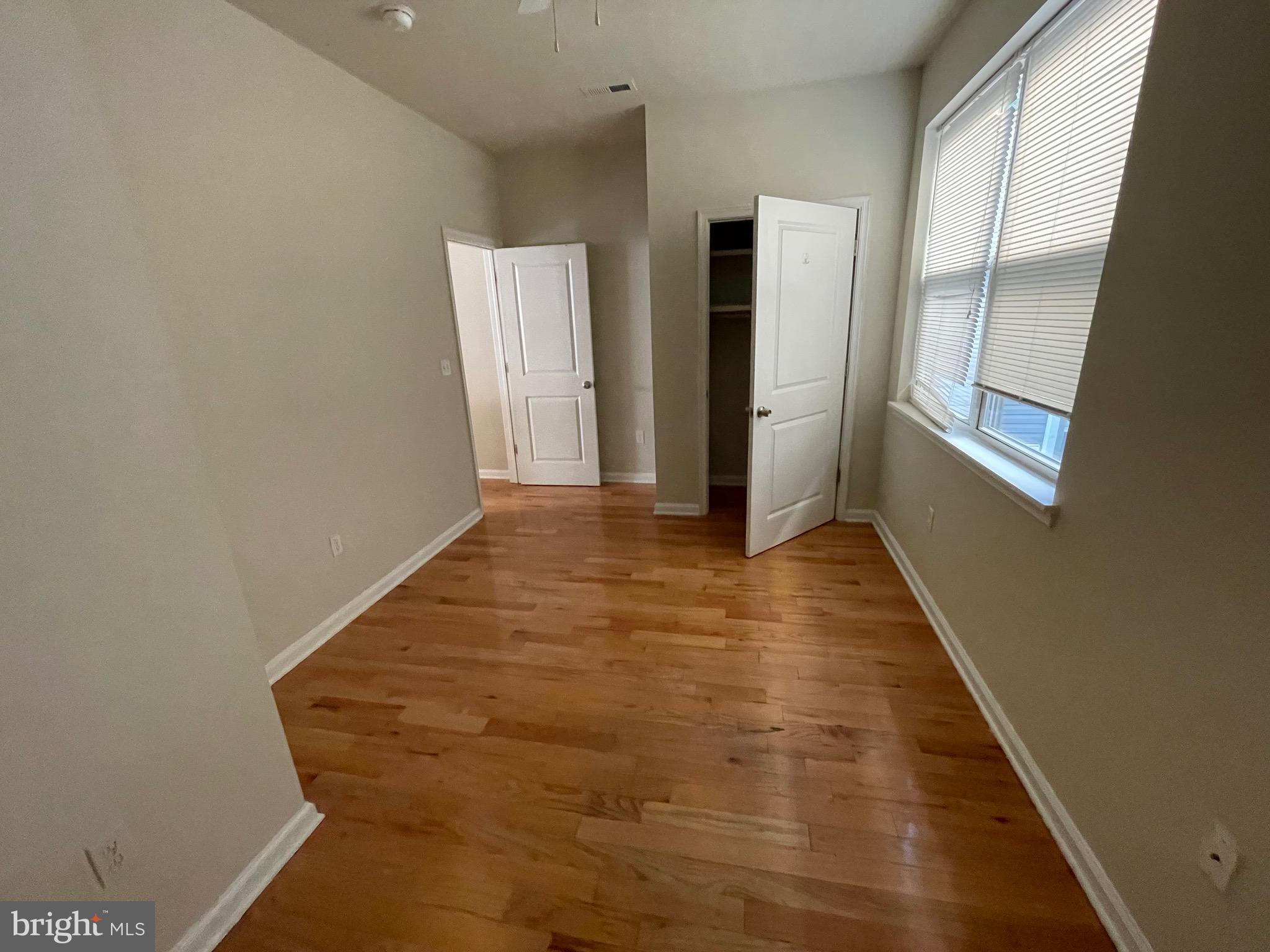 408 Wiota Street Philadelphia, PA 19104 - Photo 6 of 25 a view of a hallway with wooden floor
