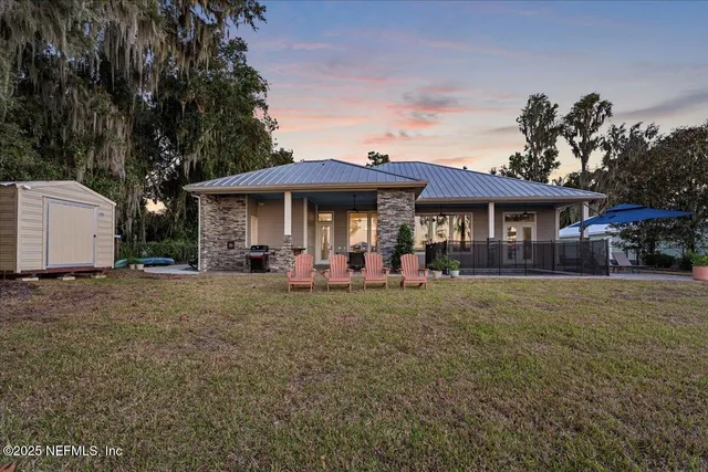 a view of a pathway with a wrought iron fence