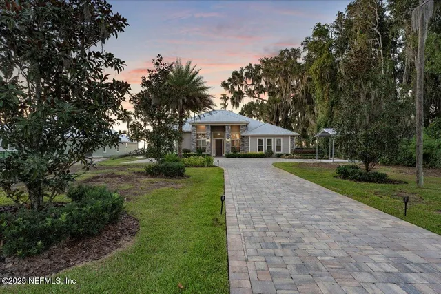 a view of house with outdoor space and garden