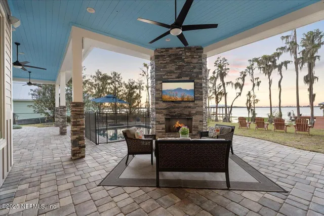 a large white kitchen with stainless steel appliances