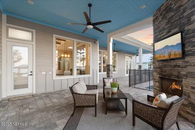 a bathroom with a granite countertop sink a mirror a shower and a bathtub