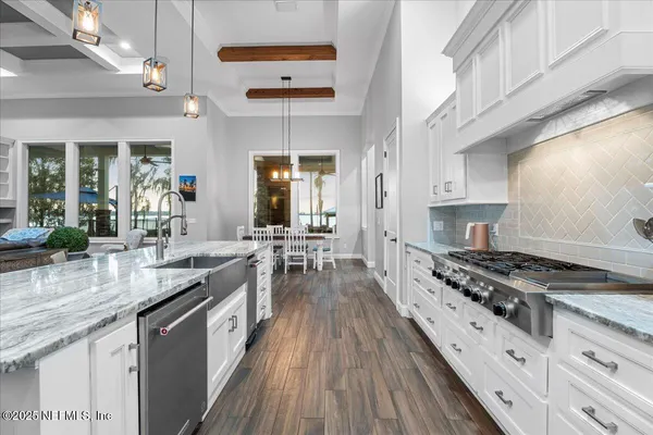 a spacious bathroom with double sink and a mirror