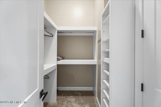 a large body of water with a building in the background