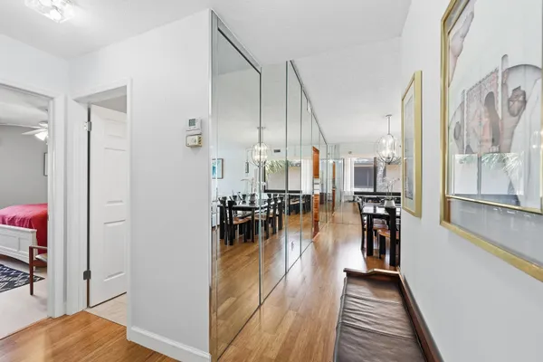 a view of a dining room with furniture and wooden floor
