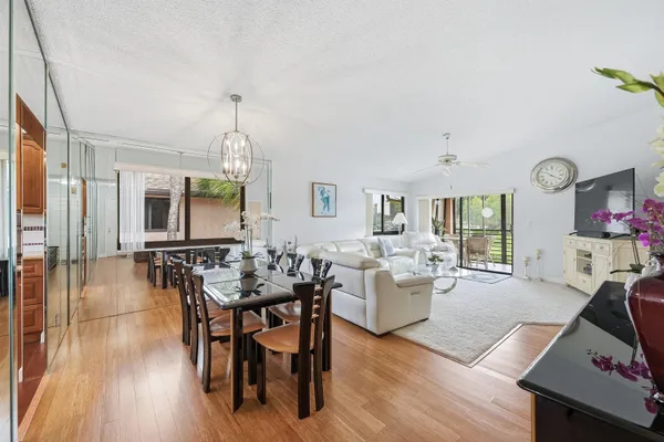 a view of a dining room with furniture window and wooden floor