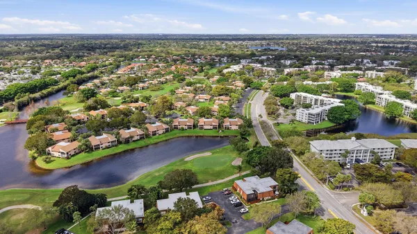 an aerial view of residential houses with outdoor space