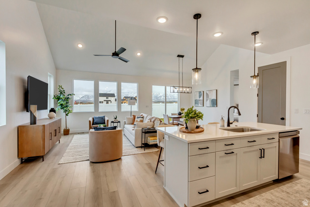 1389 1440 East, Unit 1 Payson, UT 84651 - Photo 7 of 17 Open-concept living space featuring wood-finish flooring, vaulted ceilings, and recessed lighting