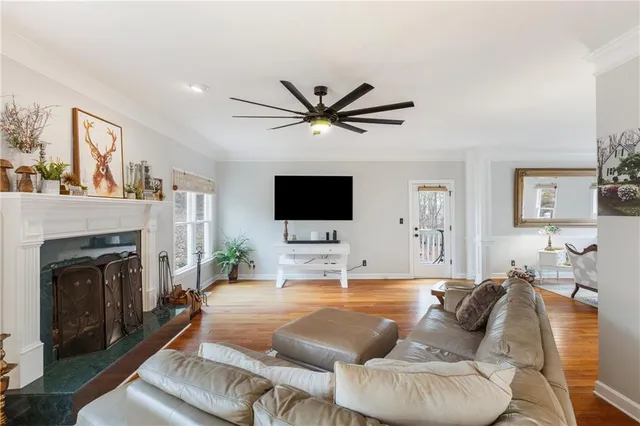a living room with furniture fireplace and a flat screen tv