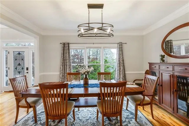 a view of a dining room with furniture window and outside view