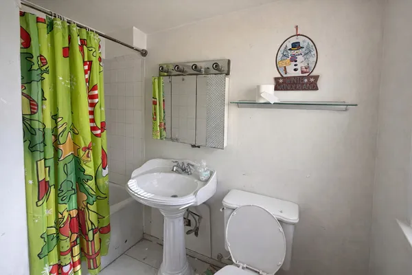 a bathroom with a sink mirror and vanity