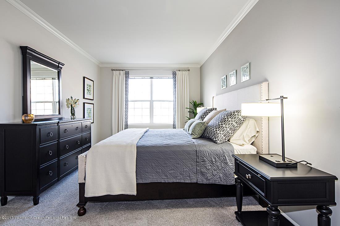 249 Broad Street, Unit 428 Matawan, NJ 07747 - Photo 6 of 27 a bedroom with a bed and a window