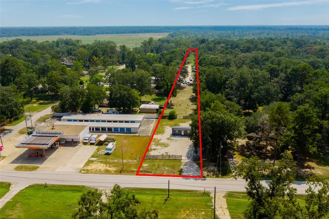a view of a swimming pool with a yard and seating area