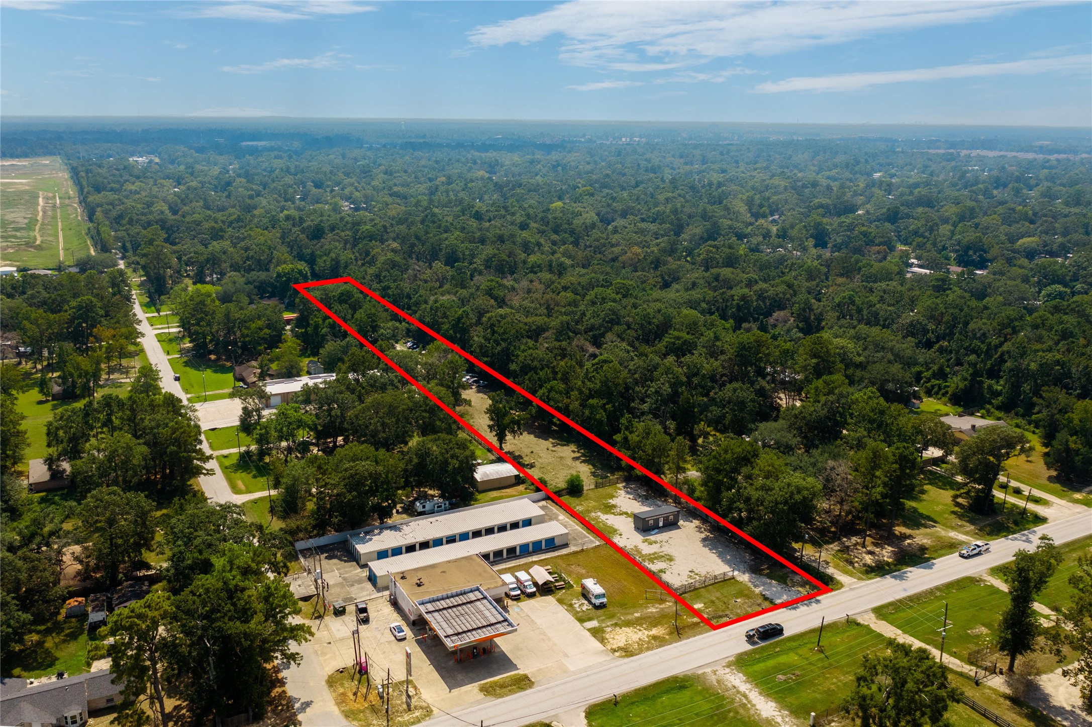 23544 Ford Road Porter, TX 77365 - Photo 4 of 15 an aerial view of residential houses with outdoor space and trees