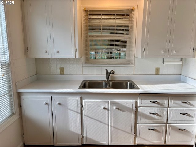 196 Northeast Flagg Street Roseburg, OR 97470 - Photo 12 of 27 a kitchen with cabinets appliances a sink and a window